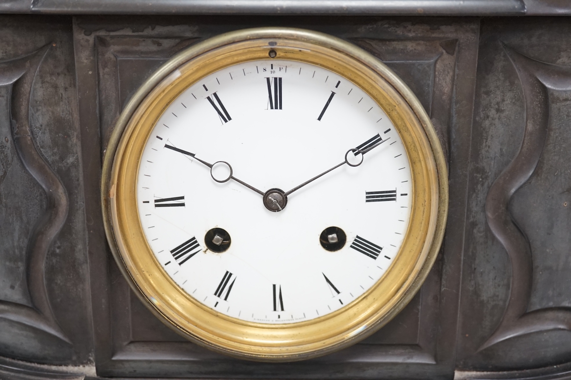 A Victorian black marble eight day mantel clock, surmounted by a cast bronze figure of a muse, with key, 48cm high. Condition - fair, untested